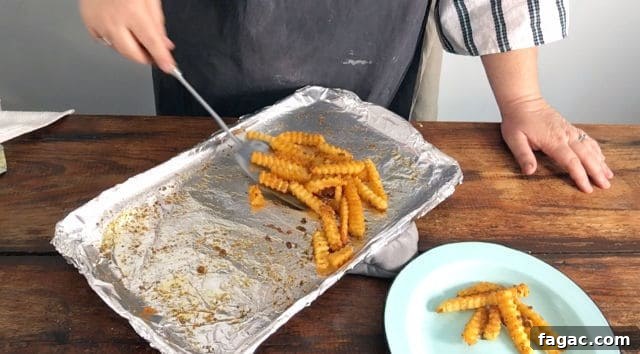 Crispy Frozen French Fries: Oven & Air Fryer Methods for Perfect Results 4 cooked frozen fries and spatula.