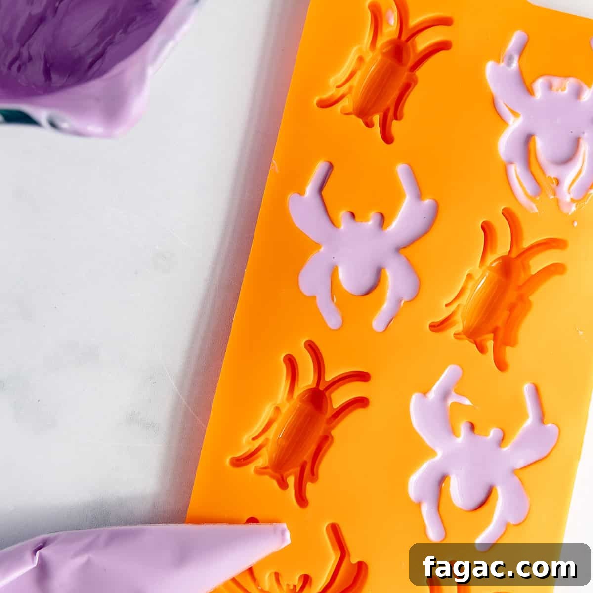 Purple candy melts formed in a spider shaped silicone mold