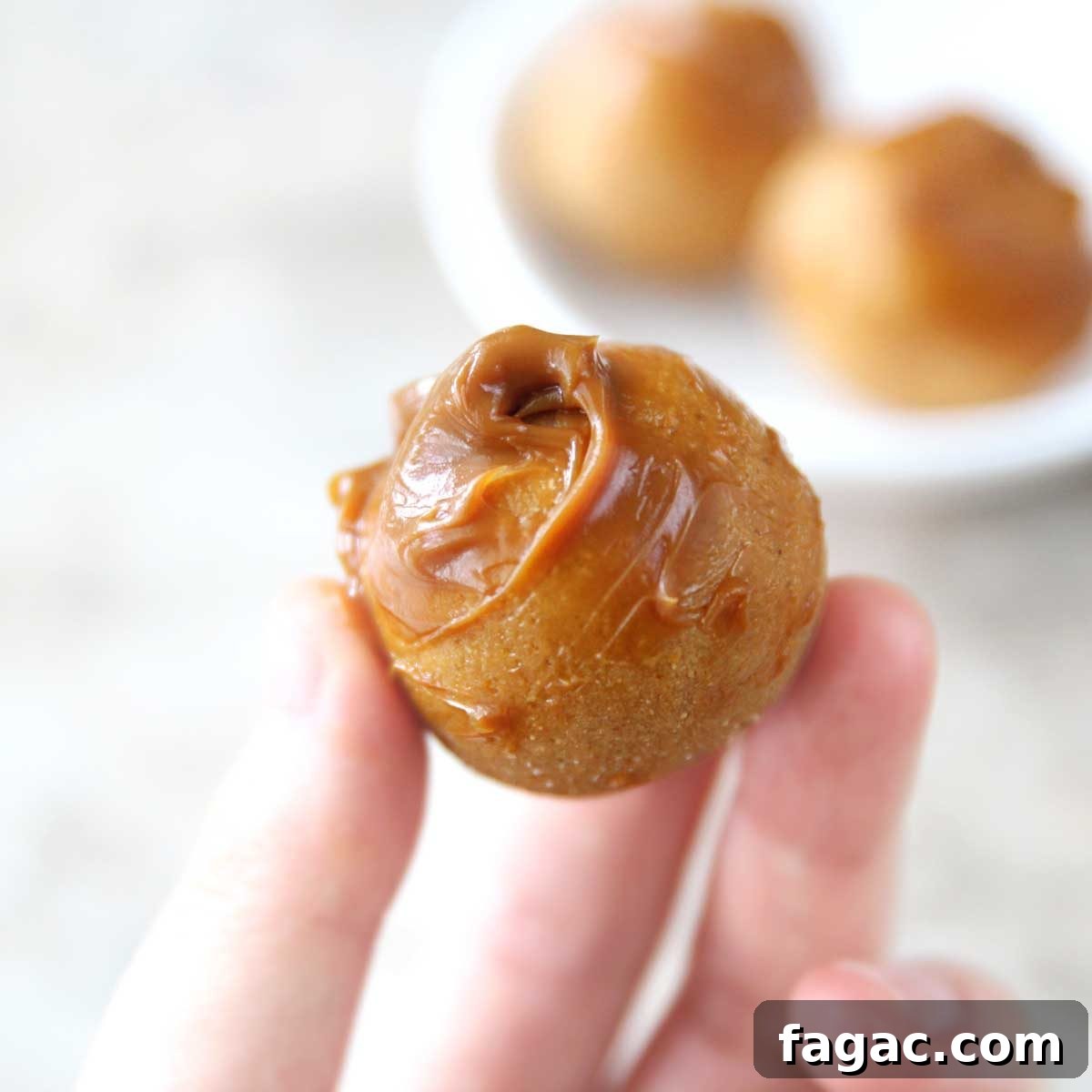 Dulce de Leche Protein Balls — 3-Ingredient Energy Bites 3 Close up of dulce de leche protein balls