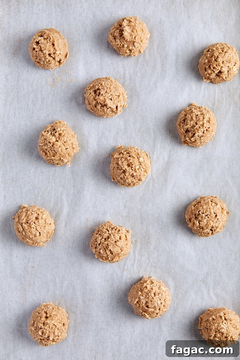 Chewy Homemade Iced Oatmeal Cookies Recipe 15 Oatmeal cookie dough balls scooped onto parchment-lined baking sheet