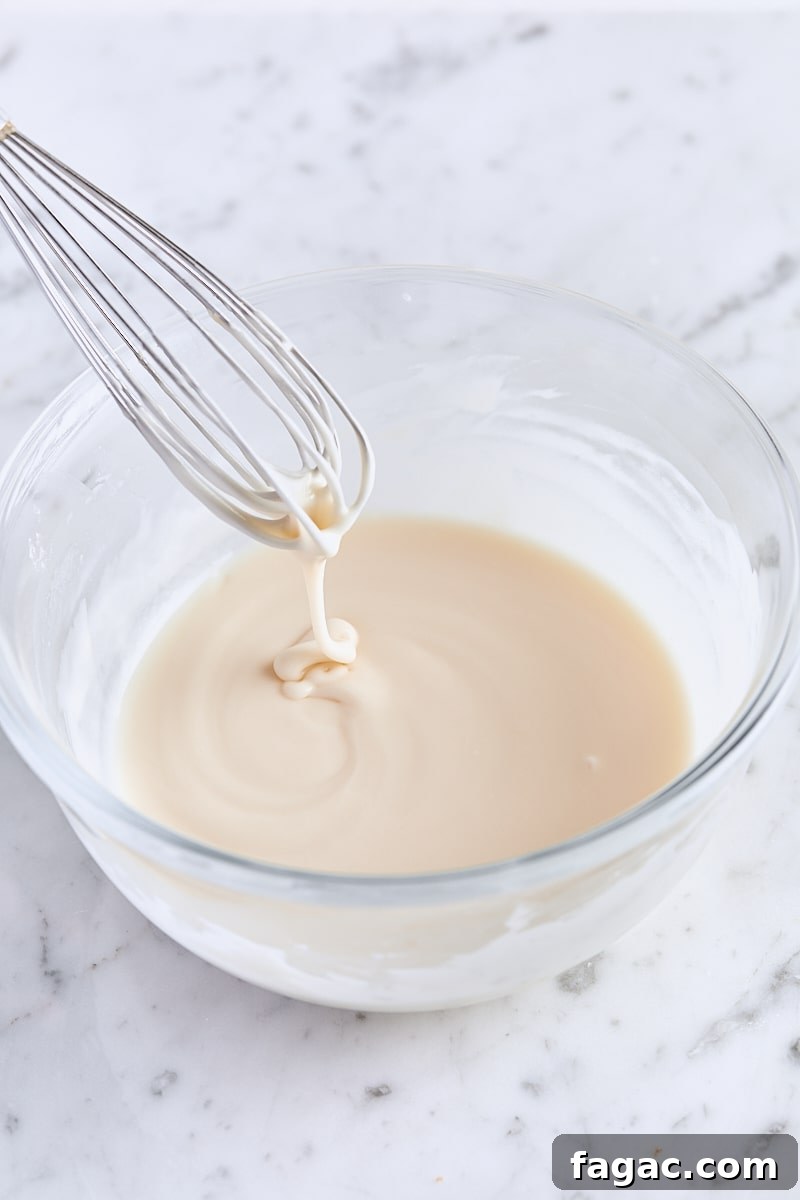Chewy Homemade Iced Oatmeal Cookies Recipe 13 Vanilla icing whisked together in glass bowl