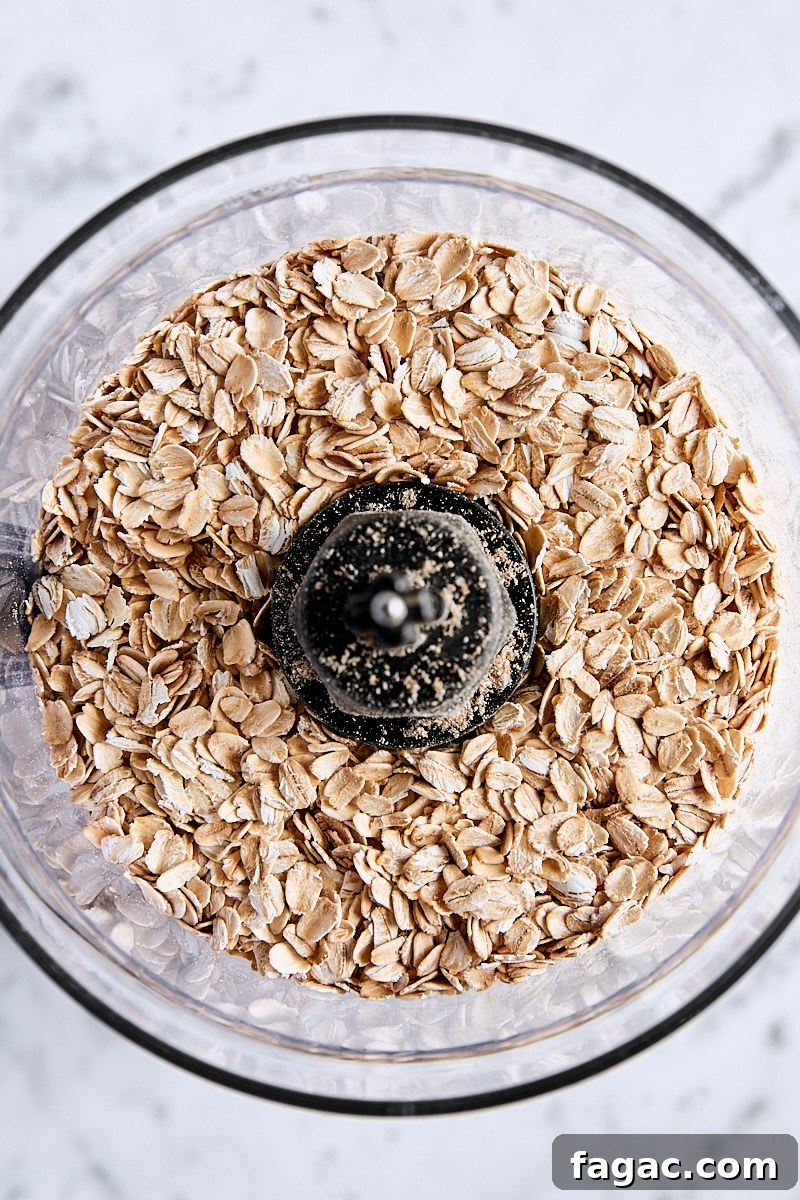 Chewy Homemade Iced Oatmeal Cookies Recipe 5 Old fashioned rolled oats in the bowl of a food processor