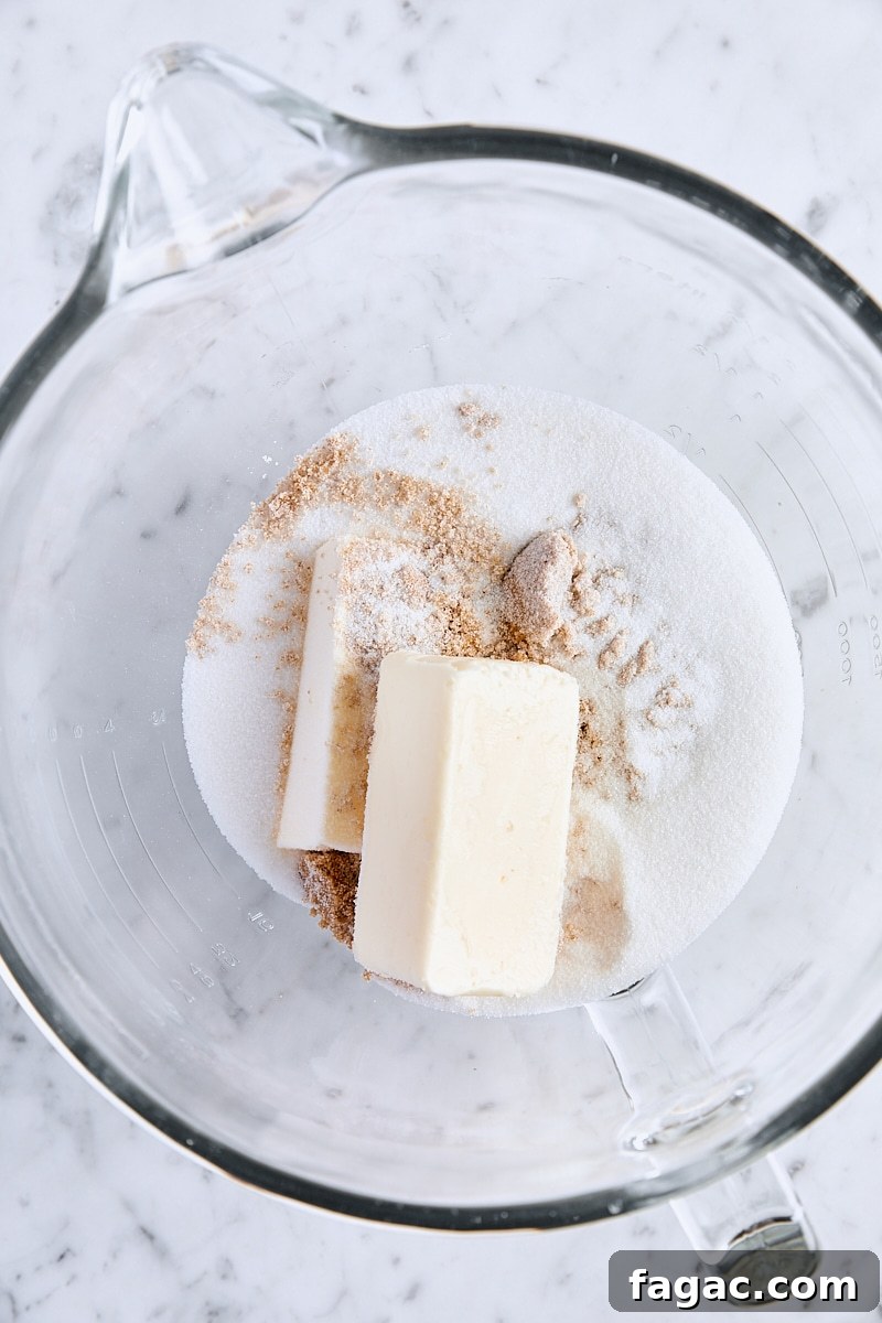 Chewy Homemade Iced Oatmeal Cookies Recipe 9 Room temperature butter, dark brown sugar, and granulated sugar in glass mixing bowl