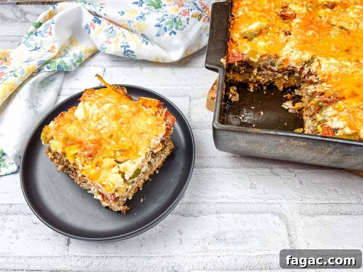 23 Classic Casseroles That Taste Like Grandma’s Comfort Cooking 12 A slice of John Wayne casserole on a black plate beside a baking dish of the same casserole.