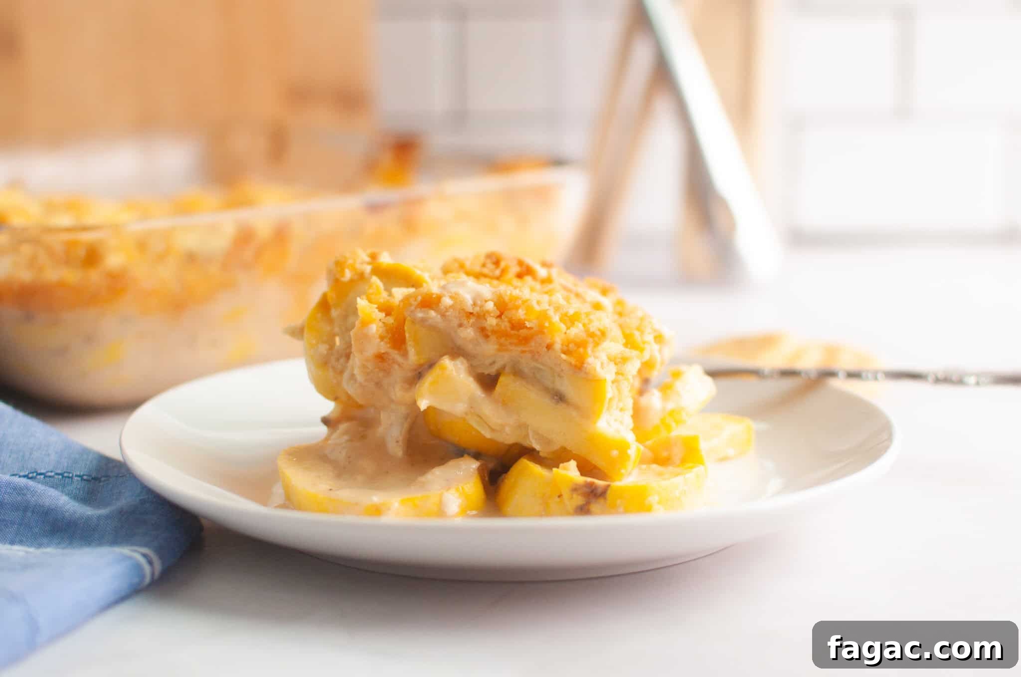 23 Classic Casseroles That Taste Like Grandma’s Comfort Cooking 5 A serving of squash casserole with a crumb topping is plated on a white dish.