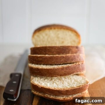 Sourdough Buttermilk Bread Recipe: Tangy Artisan Loaf Guide 18 Sourdough buttermilk bread, sliced, with a bread knife.