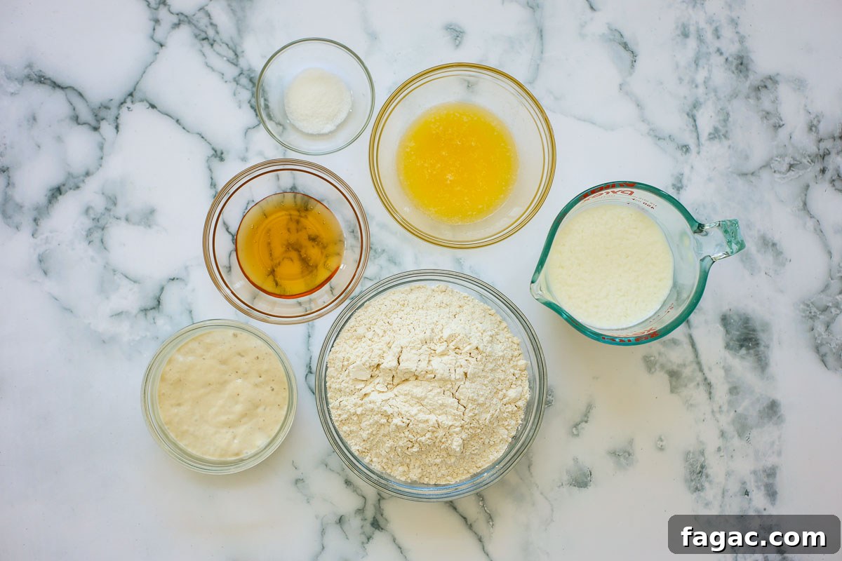 Sourdough Buttermilk Bread Recipe: Tangy Artisan Loaf Guide 3 Ingredients of this recipe in glass bowls: salt, honey, melted butter, sourdough starter, buttermilk and flour.