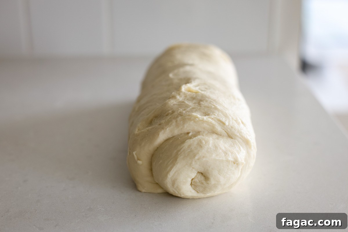 Sourdough Buttermilk Bread Recipe: Tangy Artisan Loaf Guide 9 Rolled dough shaped as a log.