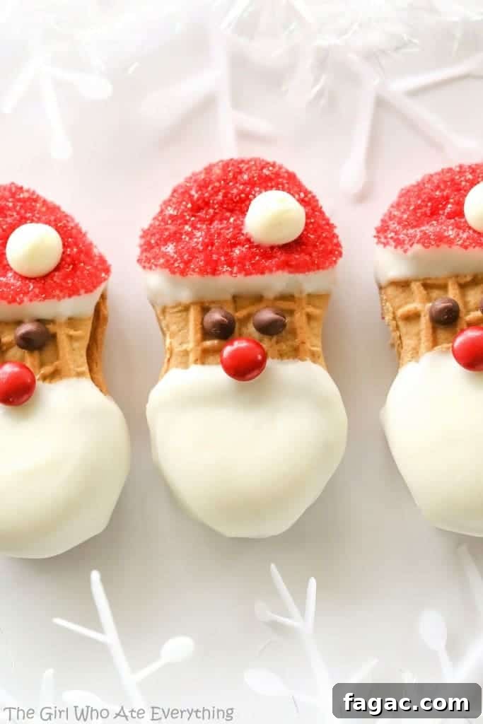 Santa Claus Cookies - easy Nutter Butter based cookies to make with your kids that are fancy enough to give to your friends. the-girl-who-ate-everything.com