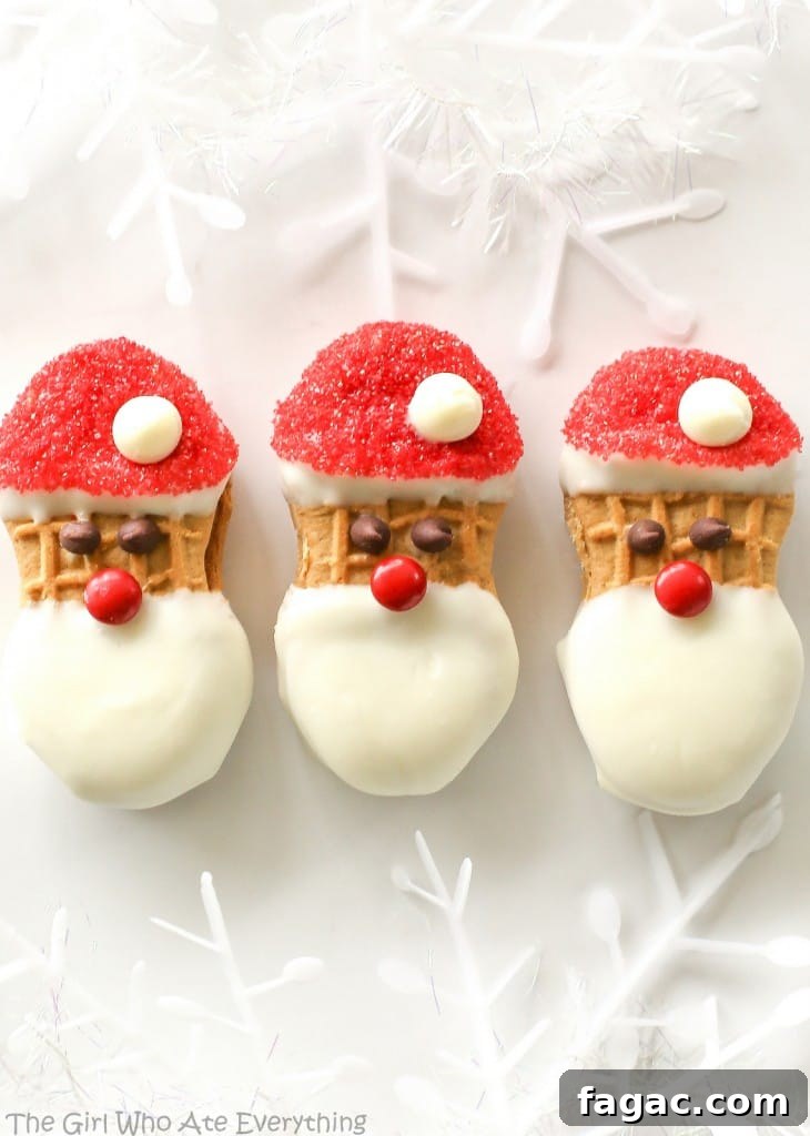 Santa Claus Cookies - easy Nutter Butter based cookies to make with your kids that are fancy enough to give to your friends. the-girl-who-ate-everything.com