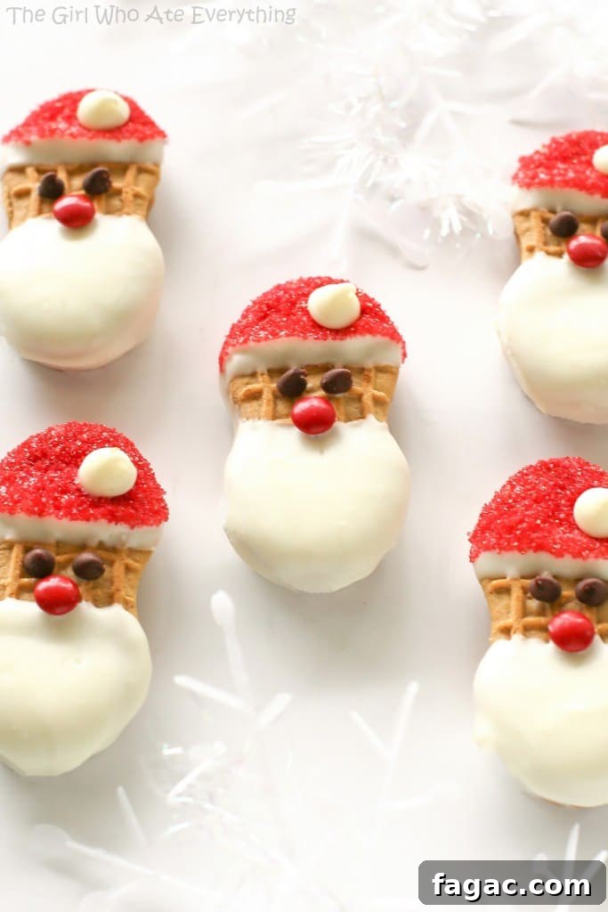 Santa Claus Cookies - easy Nutter Butter based cookies to make with your kids that are fancy enough to give to your friends. the-girl-who-ate-everything.com