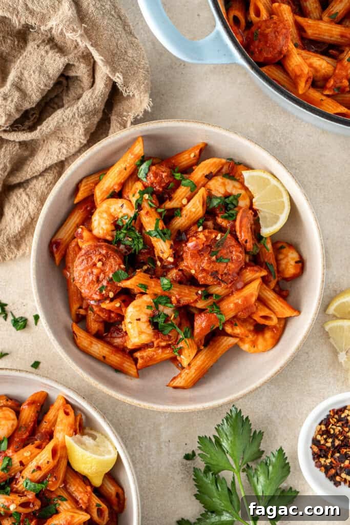 The plated prawn and chorizo pasta in bowls.