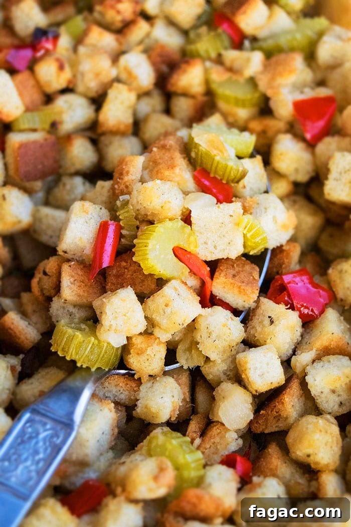 Easy One Pot Turkey Stuffing or Dressing in Large Spoon- Closeup Shot.
