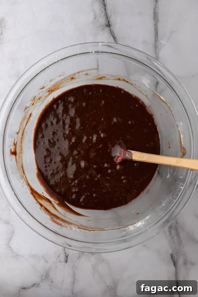 Ultimate Cosmic Brownies Recipe for Perfect Fudgy Squares 9 mixed ingredients in a bowl