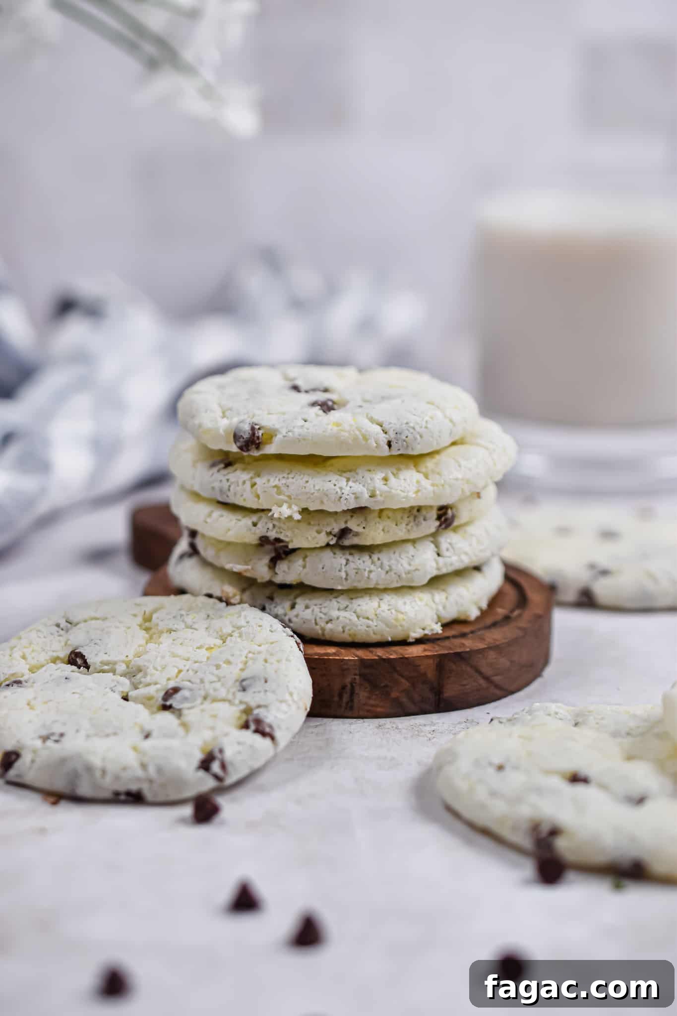 Fluffy Chocolate Chip Cookies Made with Angel Food Cake Mix 2 The cookies are stacked on a wooden plate.
