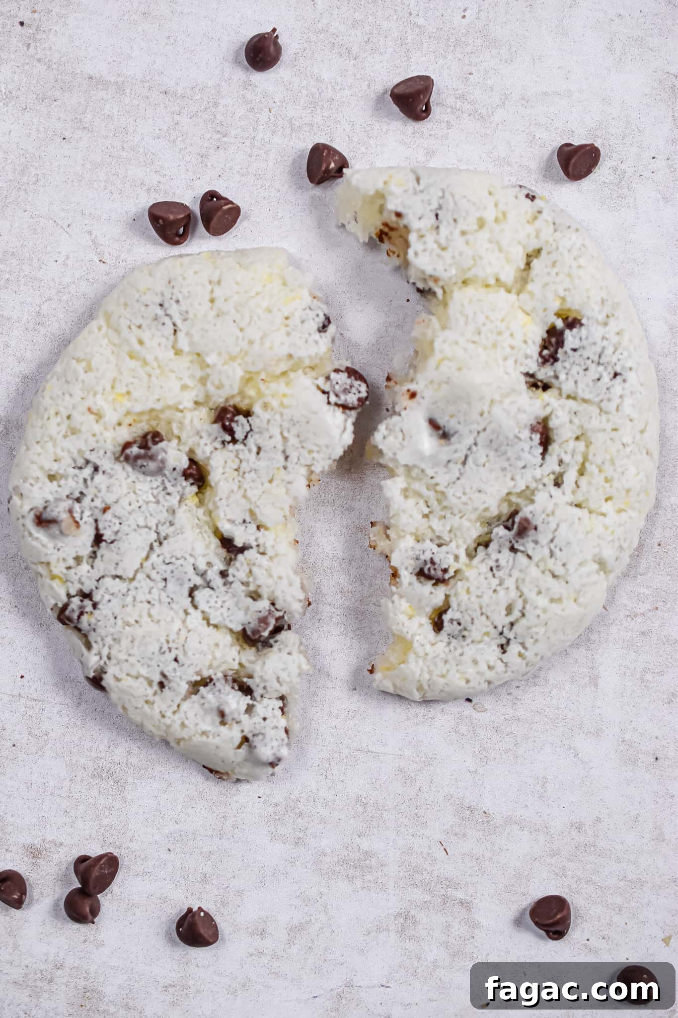 Fluffy Chocolate Chip Cookies Made with Angel Food Cake Mix 8 An angel food cake mix cookie is broken apart.
