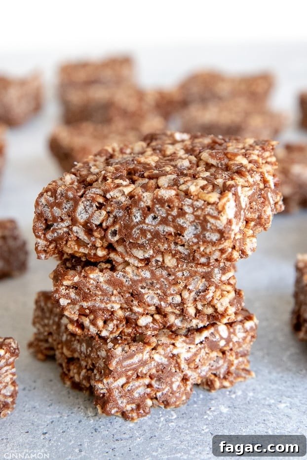 Fudgy Chocolate Rice Krispies Treats 8 Three rice krispies treats squares with more in the background