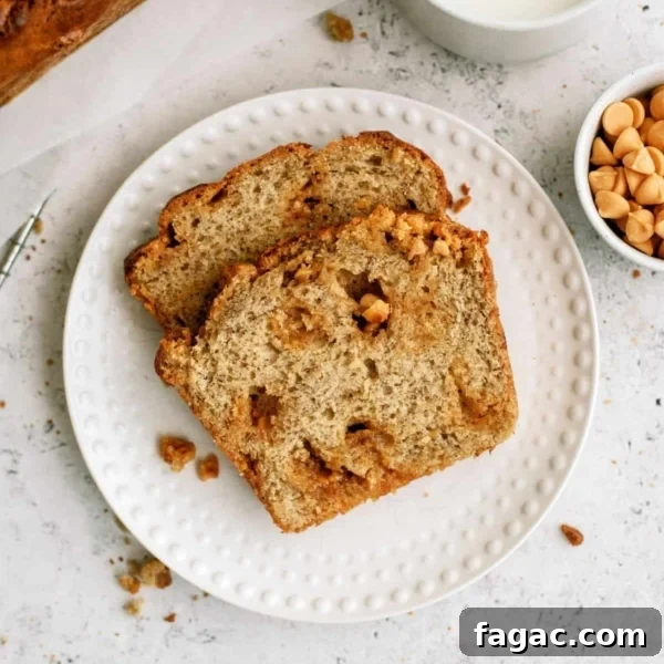 Two slices of Banana Bread on a small white plate with a cup of milk and a small cup of butterscotch chips on the side.