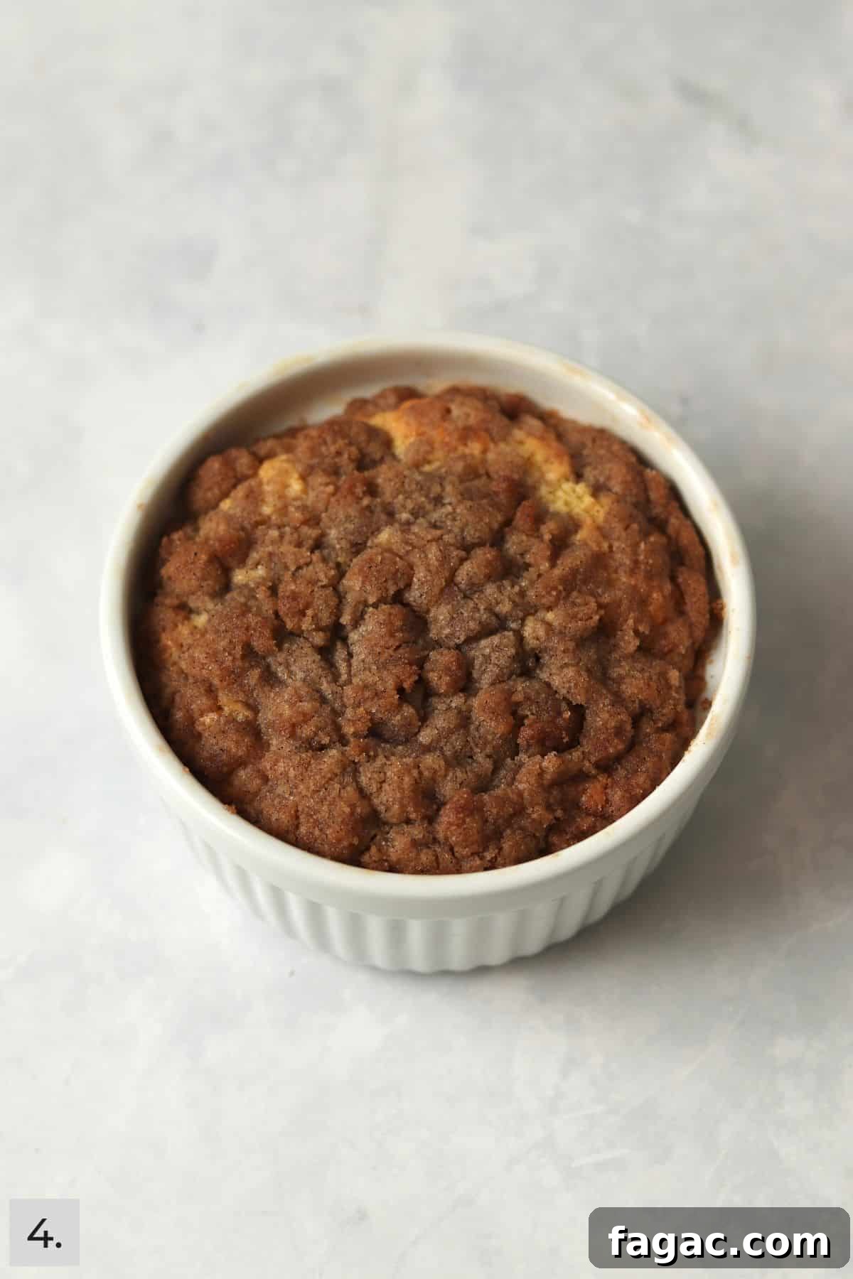 Single serve coffee cake with streusel topping in the ramekin dish.