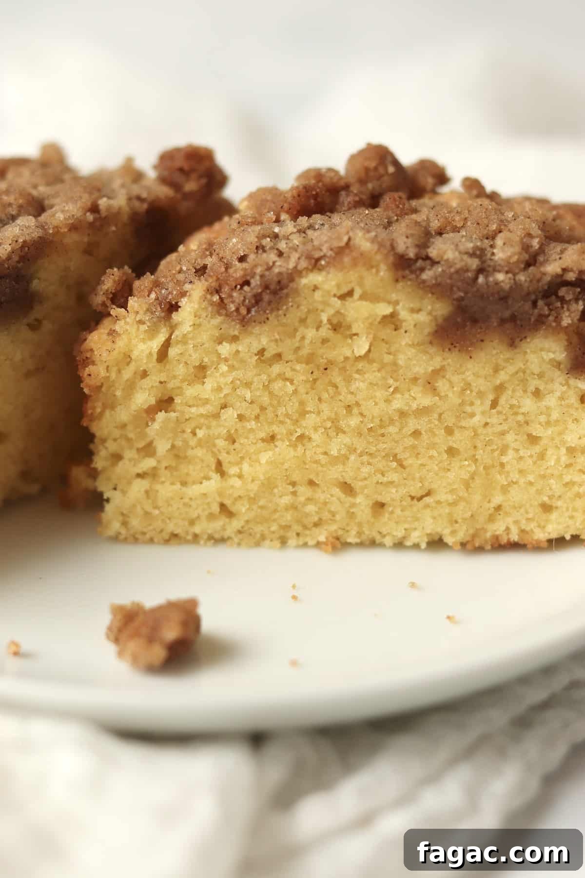 Close up of single serve streusel coffee cake cut in half.