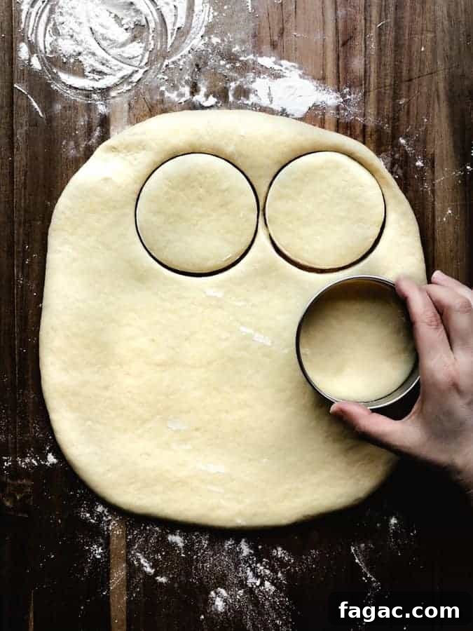 Authentic Italian Lemon Pound Cake Recipe with Zesty Glaze 13 using a circle cookie cutter to cut out donuts form dough