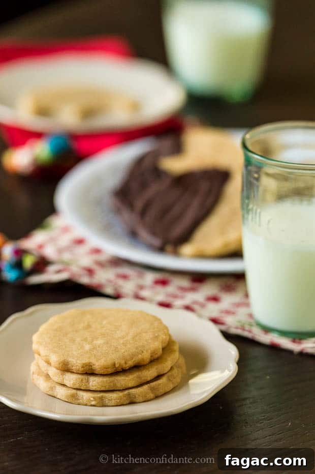 A stack of Peanut Butter Sugar Cookies next to a glass of milk.