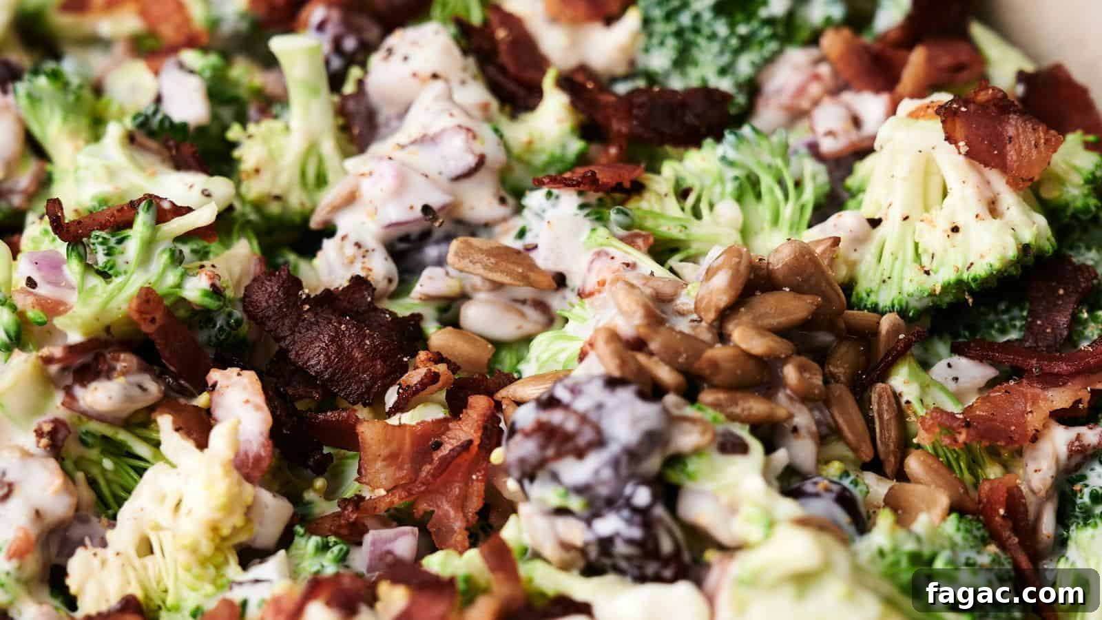 21 Easter Salad Ideas to Refresh Your Holiday Table 13 Close-up of a delightful broccoli salad with crispy bacon, sunflower seeds, and a creamy dressing. Mixed ingredients are visible in detail, showcasing the vibrant textures and colors of this fresh broccoli salad.