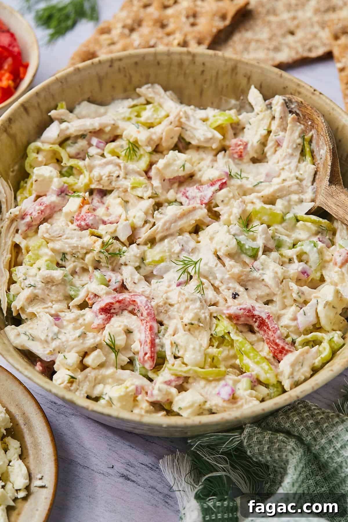 a side view of a bowl of chicken salad