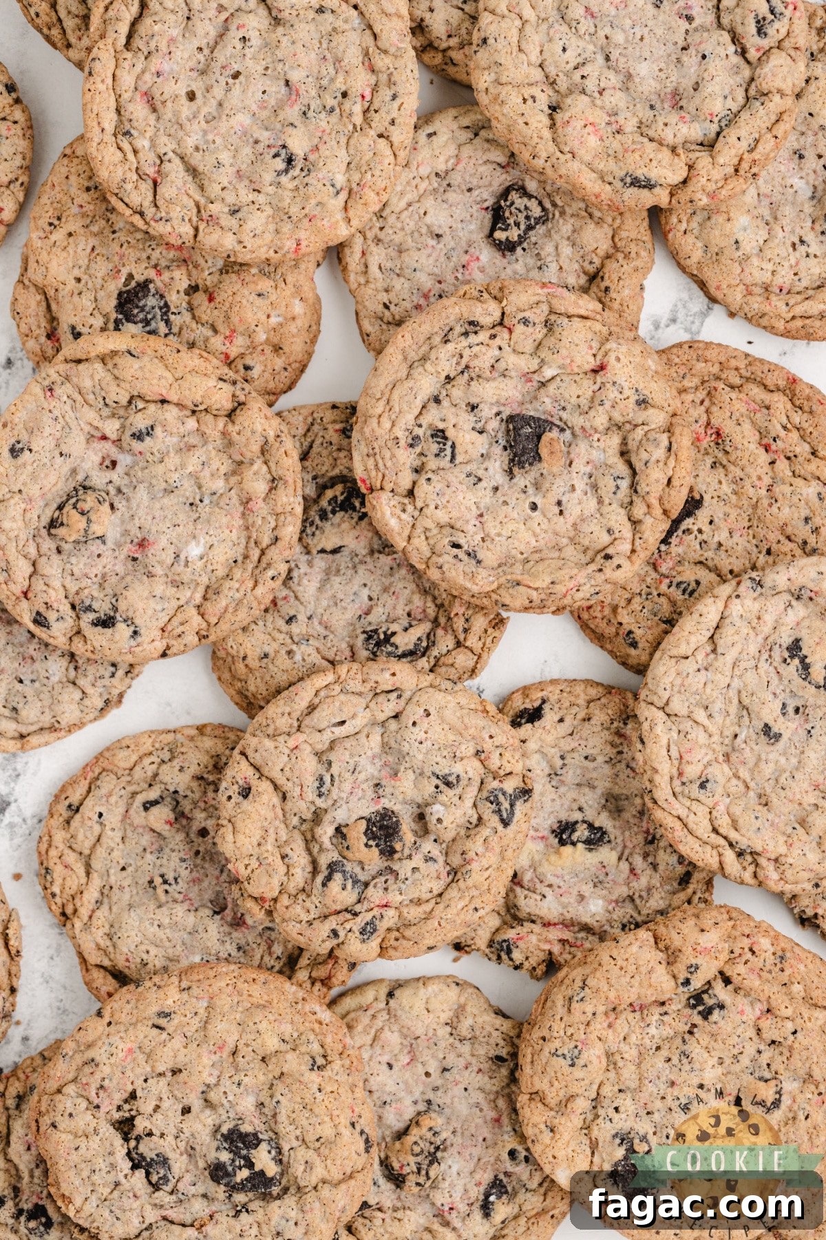 Peppermint Oreo Cookies are made with pudding mix, Oreo cookies, crushed candy canes and peppermint extract. This delicious peppermint cookie recipe yields a perfectly soft and chewy cookie that is sure to be a favorite holiday cookie!