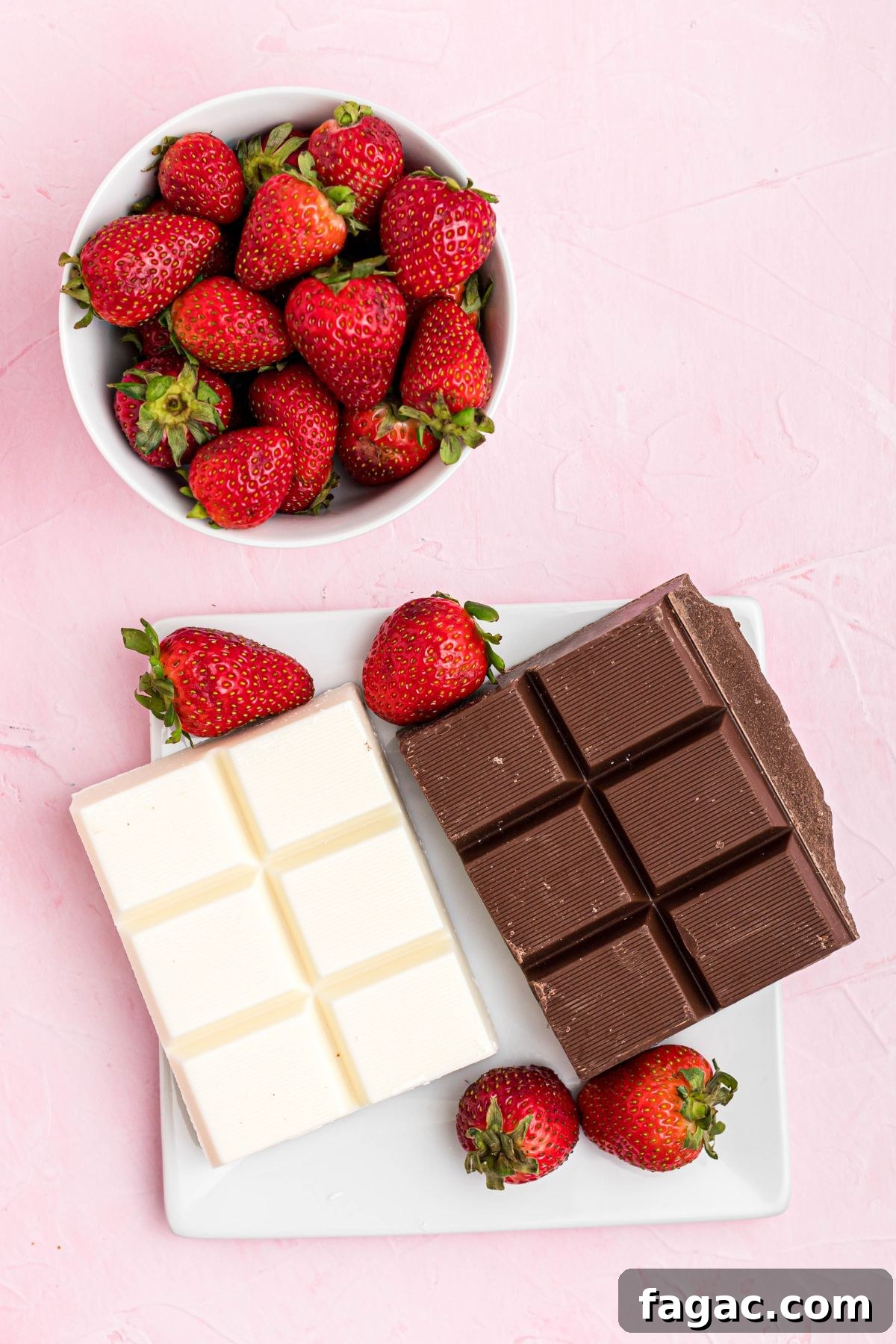How to Make Chocolate-Covered Strawberries 3 Blocks of chocolate and white chocolate on a white square plate with fresh berries in a bowl.