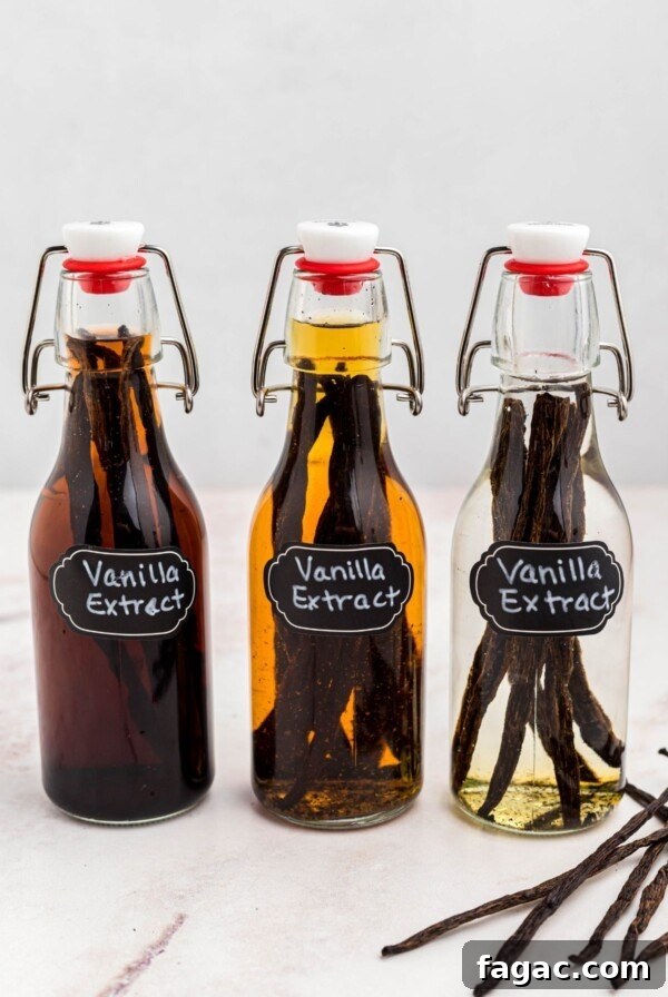 Three bottles of vanilla in different stages of sitting with pods.
