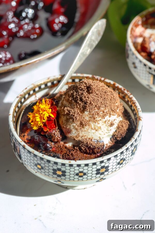 French 75 Grapes: Growing Guide and Wine Uses 8 cherries jubilee with ice cream topping and shaved chocolate shavings in a bowl with a spoon.