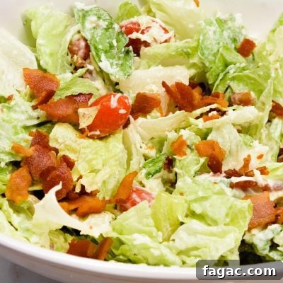BLT salad is a simple salad recipe combining lettuce, tomatoes, mozzarella cheese, and bacon crumbles