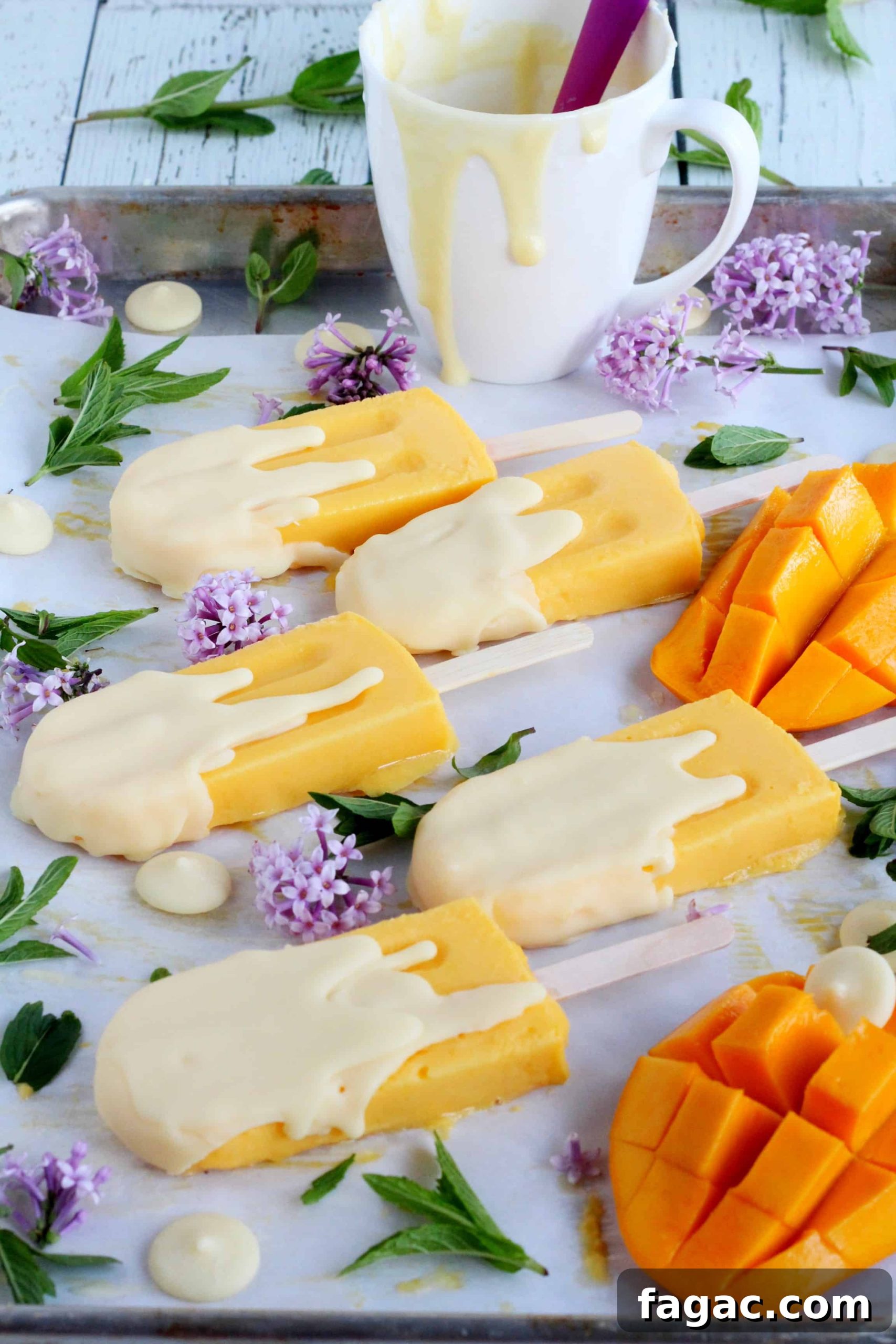White Chocolate Dipped Mango Popsicles 2 mango popsicles
