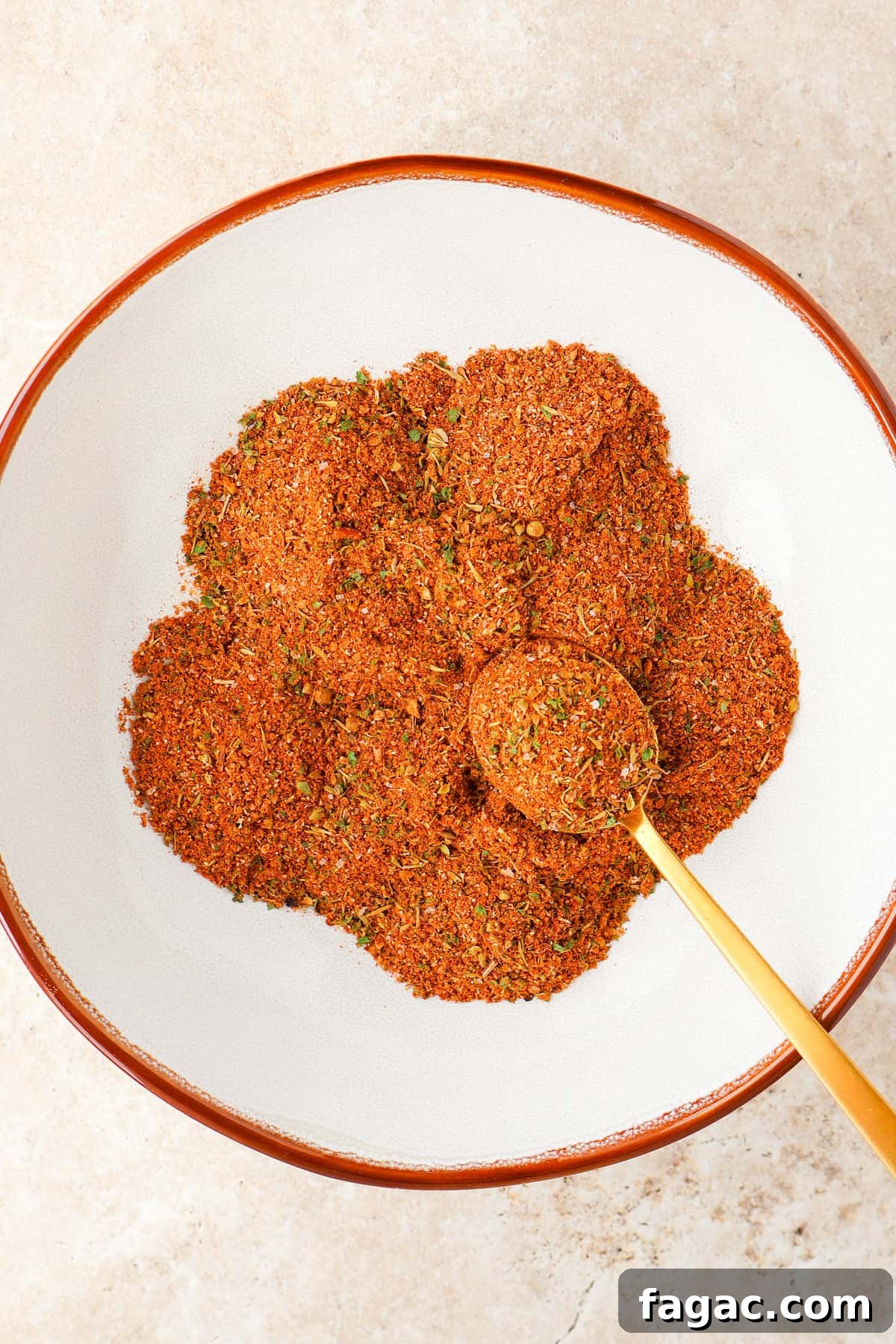 Authentic Gyro Seasoning Recipe & Spice Blend for Gyros 2 Gyro seasoning in a bowl with a spoon.