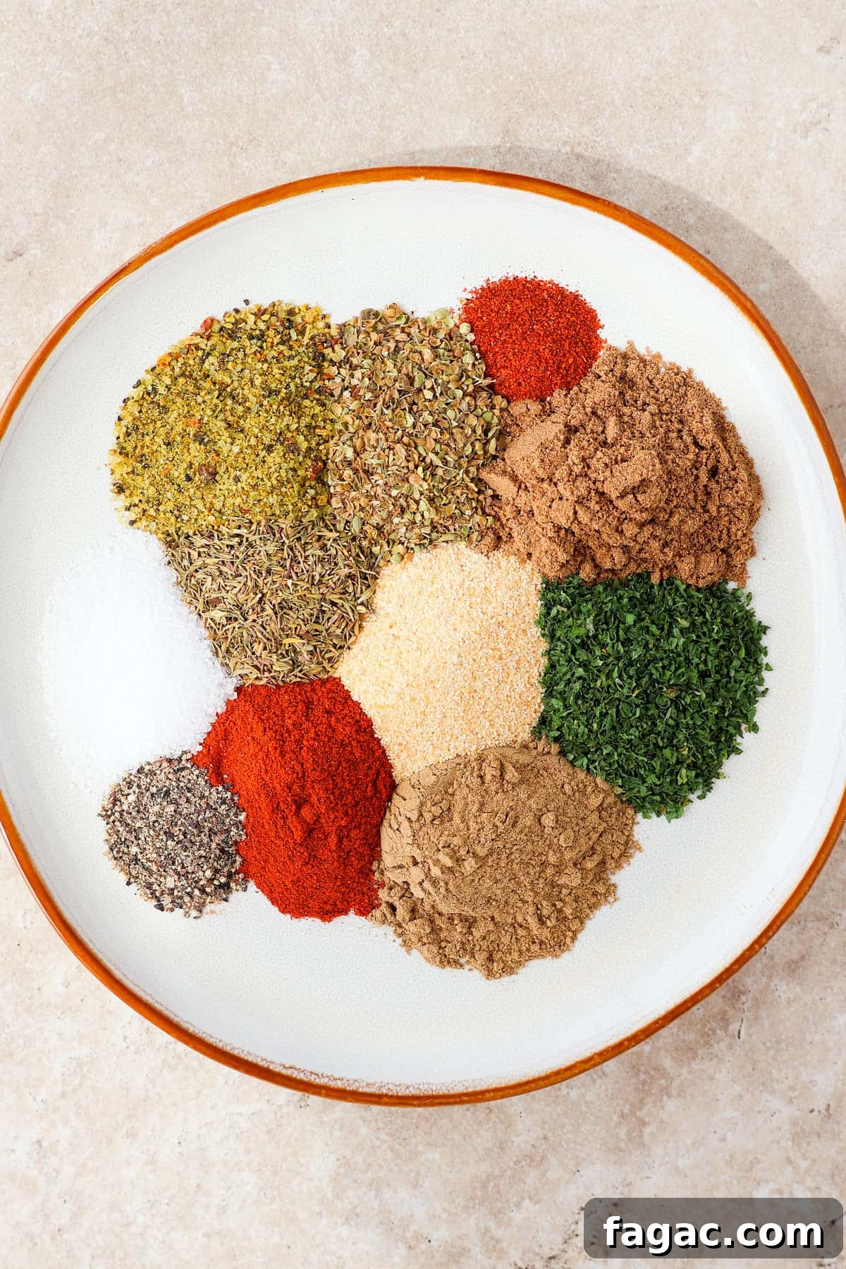 Authentic Gyro Seasoning Recipe & Spice Blend for Gyros 4 Indvidual spices on a plate.