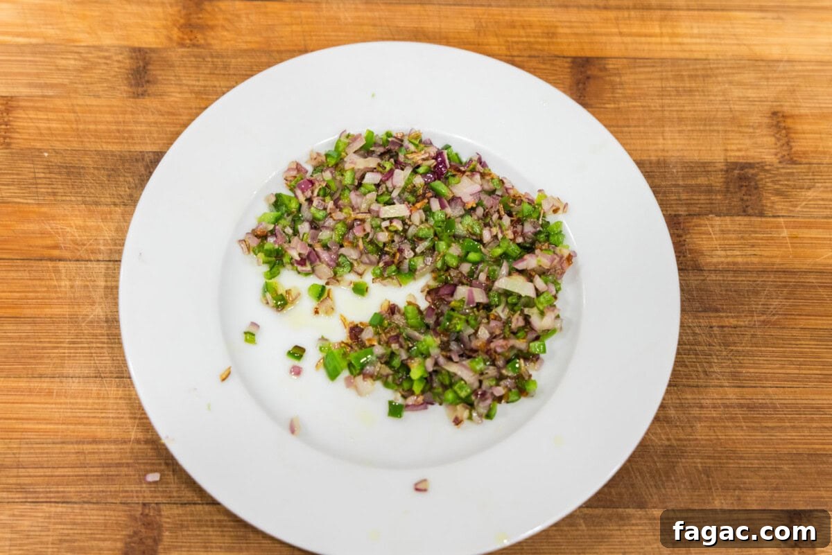 Buffalo Burger Recipe with Blue Cheese and Crispy Onions 6 sauteed onions and jalapenos on a plate