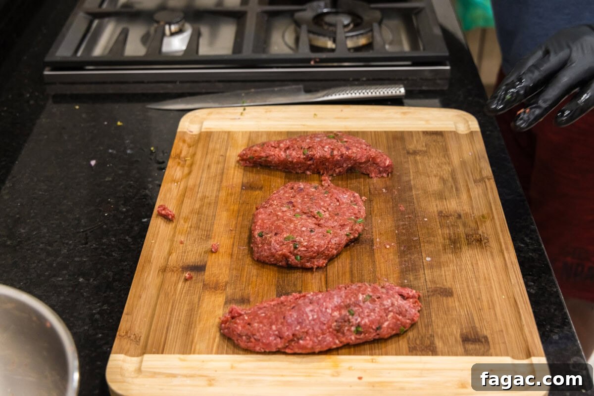 Buffalo Burger Recipe with Blue Cheese and Crispy Onions 8 ground bison patties on a cutting board