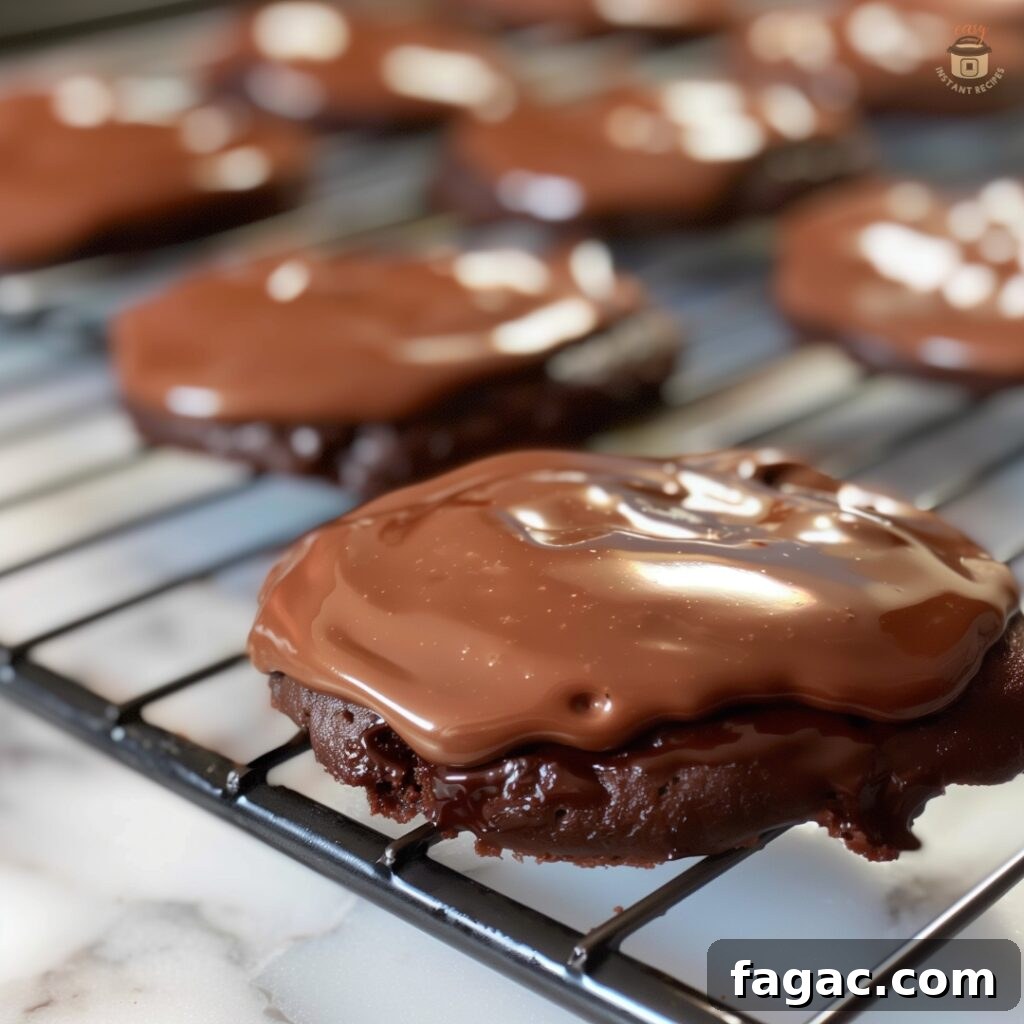 Texas Sheet Cake Cookies Recipe & Baking Tips 2 Close-up of Texas Sheet Cake Cookies with rich chocolate frosting drizzled over chewy chocolate cookies, perfect for dessert lovers.