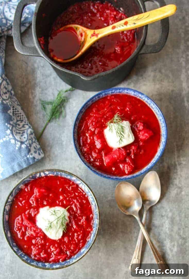 Authentic Ukrainian Borscht Recipe: Beet Soup 5 black pot and two blue and white bowls filled with Ukrainian borscht