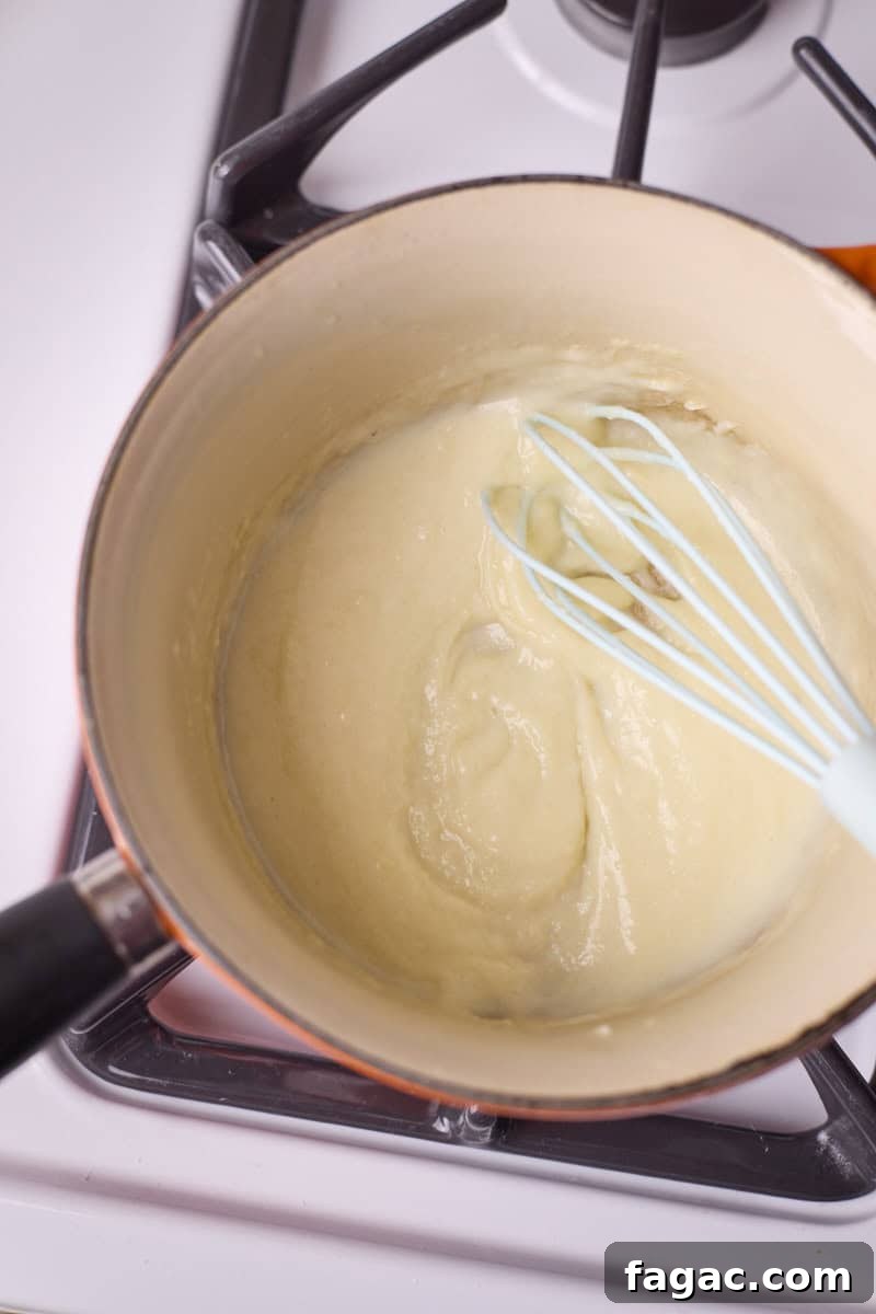Creamy Beer Cheese Dip for Soft Pretzels 6 Mixture thickened with milk and beer.