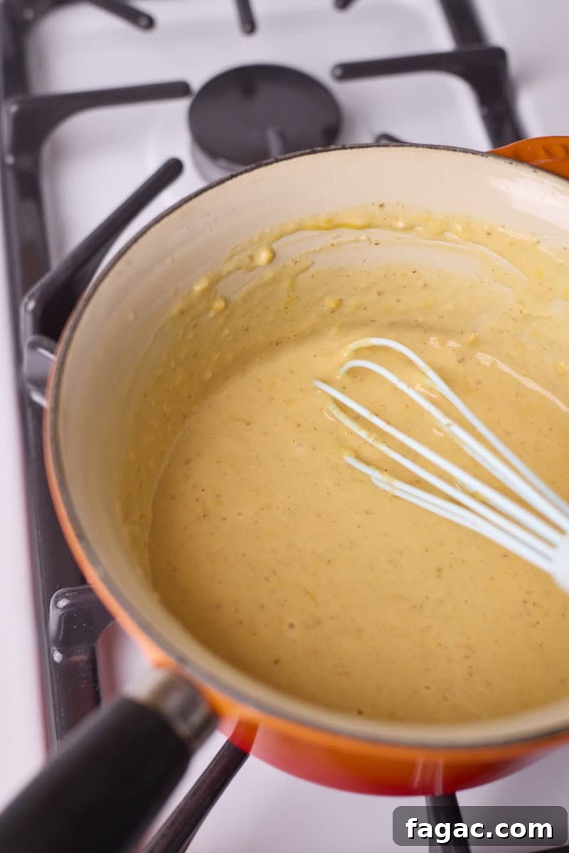 Creamy Beer Cheese Dip for Soft Pretzels 7 Smooth mixture after whisking in the cheese.