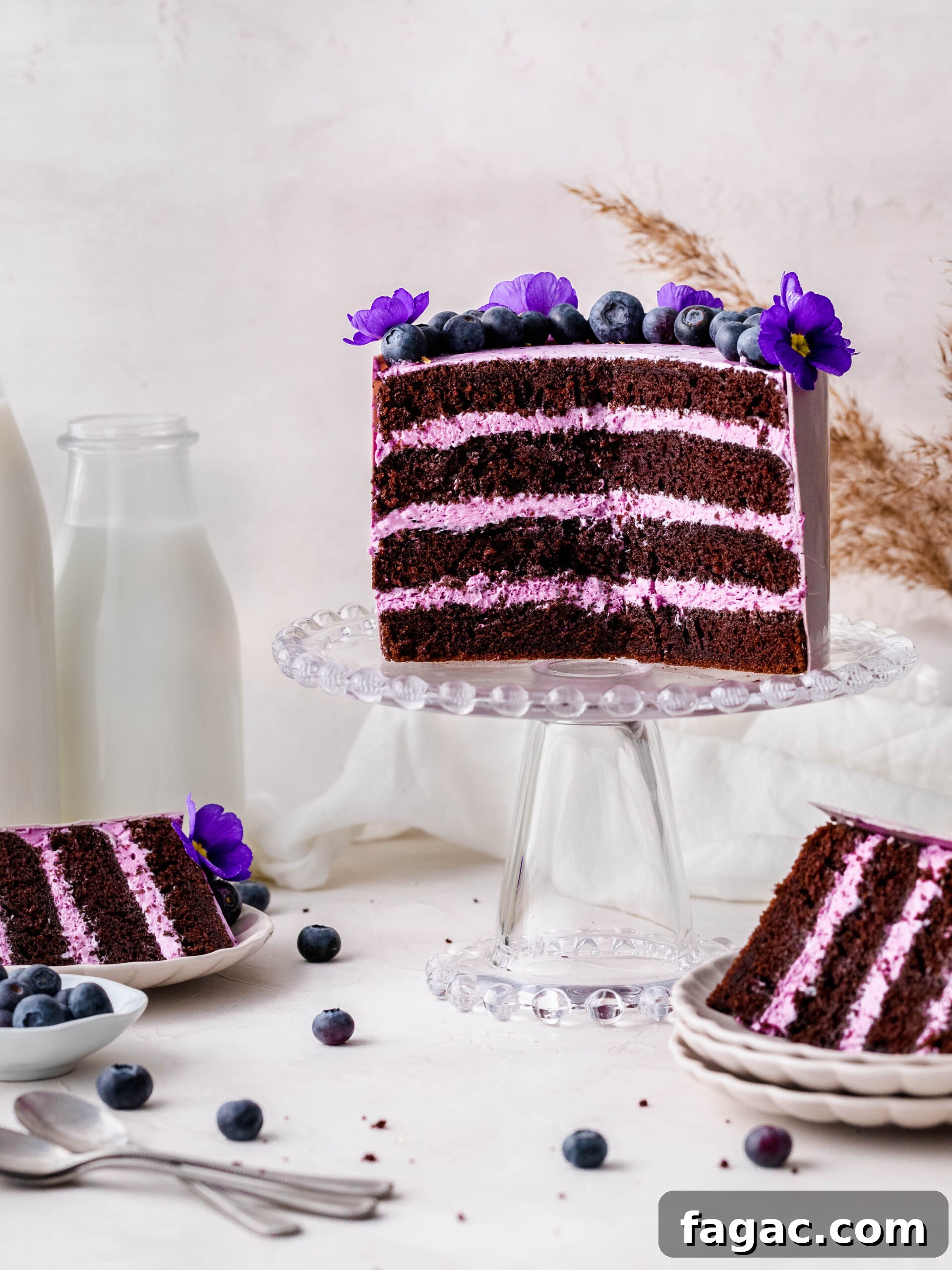 Blueberry Cream Cheese Chocolate Cake Recipe 2 Blueberry Cream Cheese Chocolate Cake on a cake stand.
