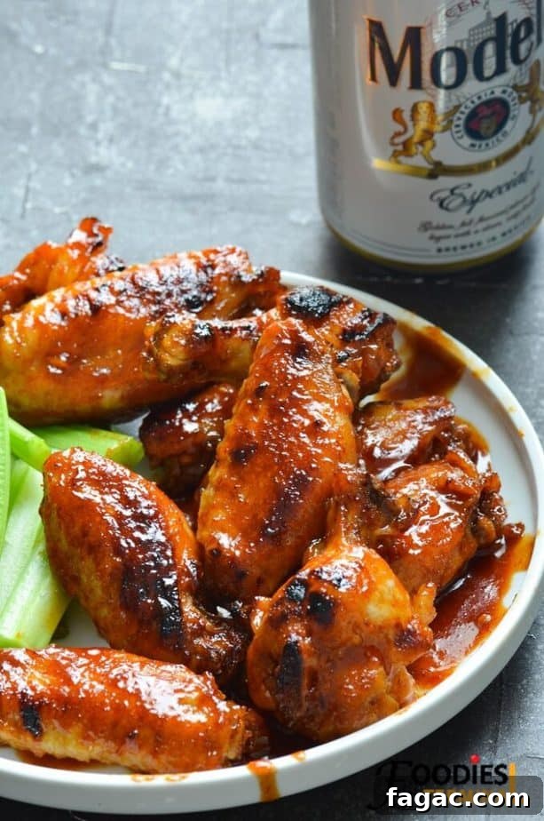 Sticky BBQ Chicken Wings in the Instant Pot 2 instant pot bbq chicken wings frozen served on a white plate with beer