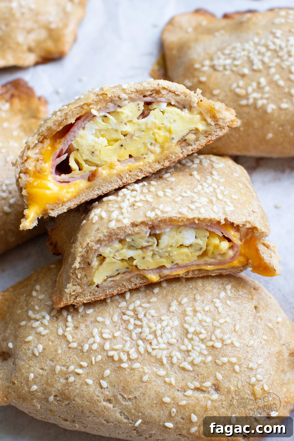 Breakfast Hot Pockets made with freshly milled flour: eggs, bacon, ham, and cheese wrapped in a flaky crust. whole wheat breakfast hot pockets