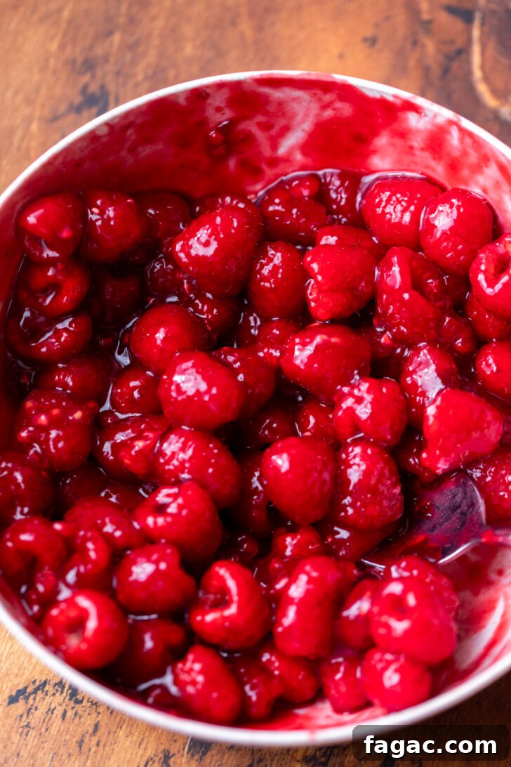 Decadent Raspberry Cheesecake Recipe 7 Raspberry topping in a bowl.