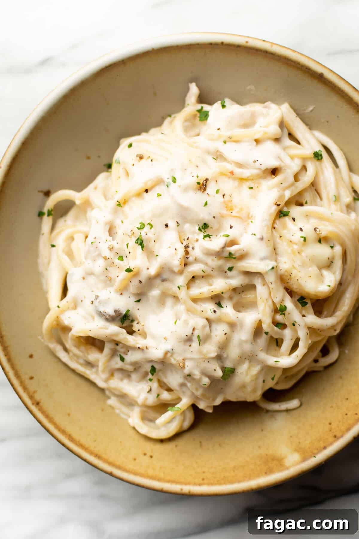 Creamy Turkey Tetrazzini with Mushrooms and Parmesan 6 a bowl of cheesy turkey tetrazzini