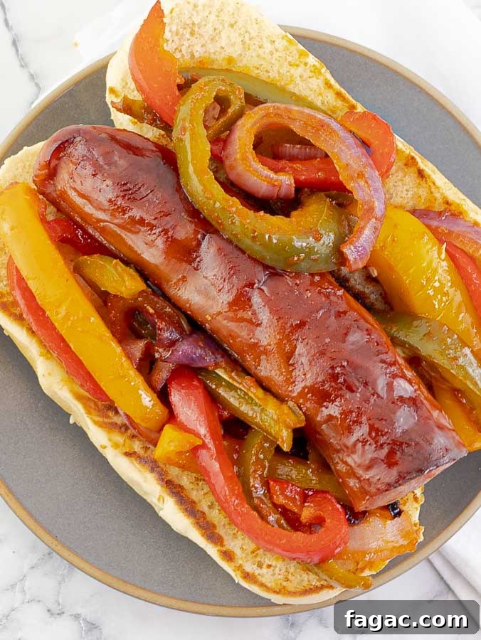 Crispy Sheet Pan Polish Sausage Sandwiches 2 Sheet Pan Polish Sausage Sandwich Recipe on a grey plate
