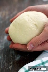 Crispy Homemade Pizza Crust: Step-by-Step Recipe 4 Rolling out pizza crust