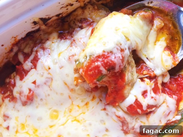 Baked Pesto Chicken in Creamy Pasta Sauce 7 Portion of pesto chicken with melted cheese and sauce